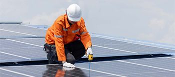 An engineer working on the solar panels