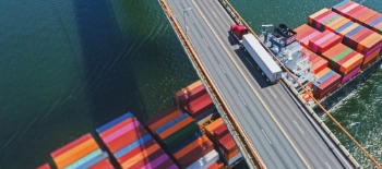 Cargo shipping below a highway Cargo shipping below a highway