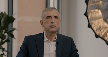 A headshot of Massimilano