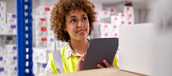 A woman working on Ipad