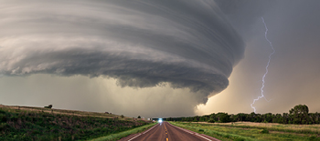 A tornado and lightning striking