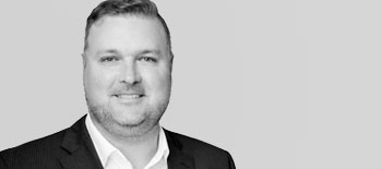 A headshot of Alex Barker