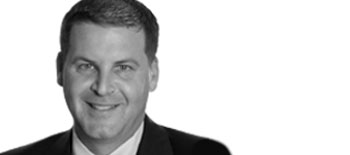 A headshot of Ed Totten