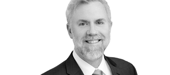 A headshot of Peter Ukstins