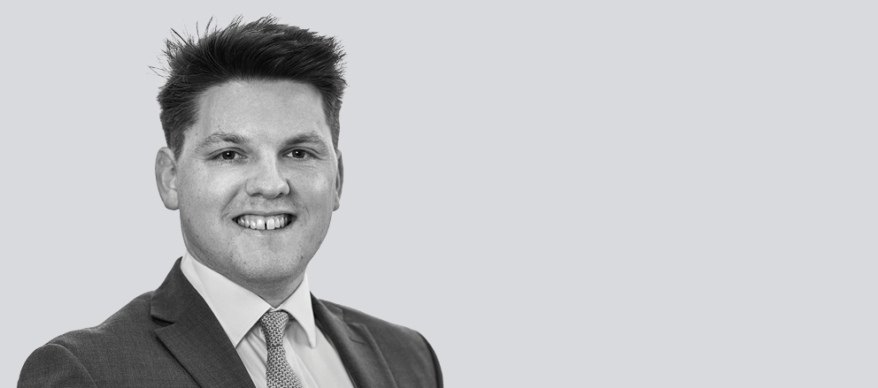 A headshot of Alec Vassey