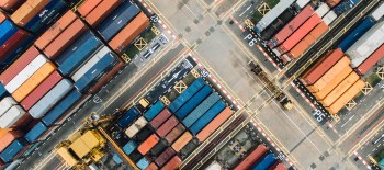 Cargo ships parked in dockyard