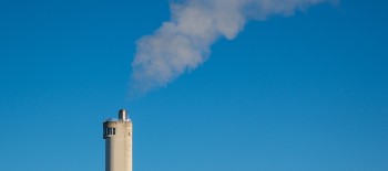 Smoke coming out of a chimney on a building