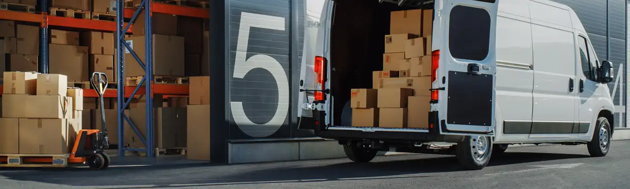 A shipment of boxes loaded in a car